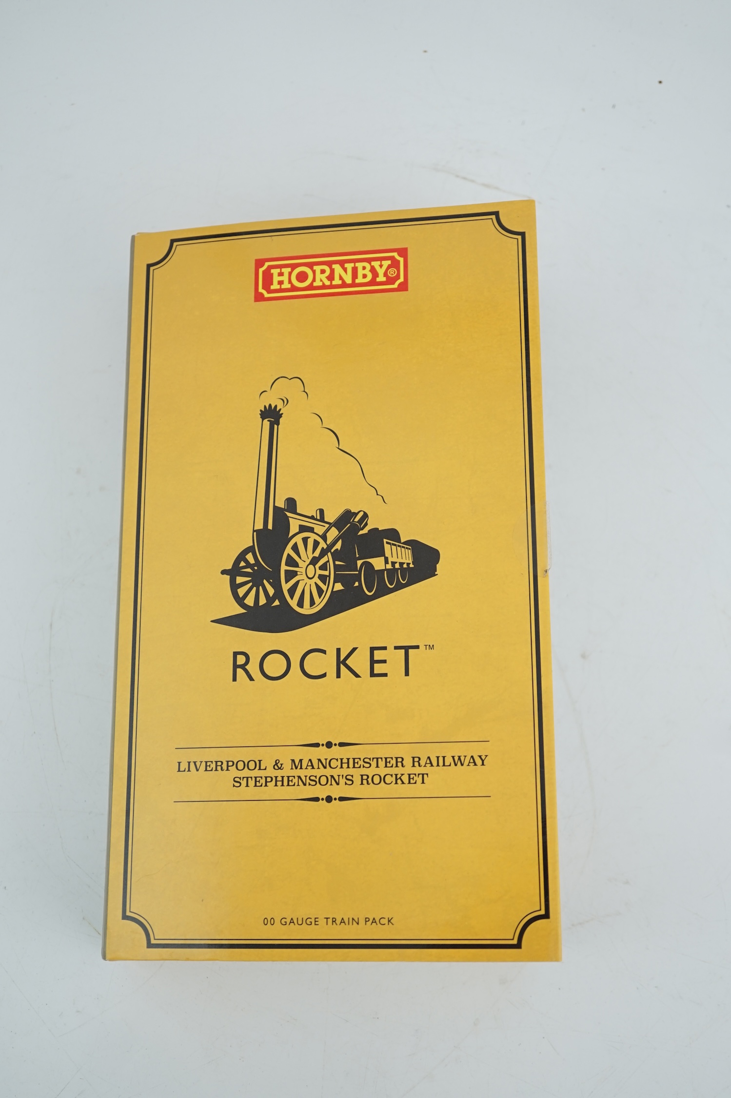 A Hornby Hobbies 00 gauge Rocket train pack (R3810), comprising of Stephenson’s locomotive Rocket and three Liverpool and Manchester 4-wheel coaches